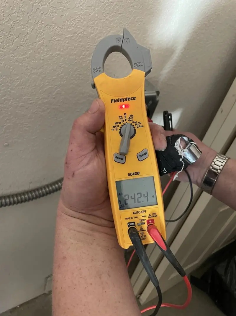 Voltage testing with clamp meter during Recessed Lighting Installation in Tyrone